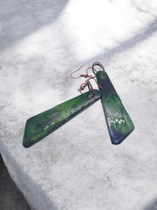 Artymunk3y Abstract Swirl Dangle Earrings in deep green with glossy finish and copper-toned ear wires.