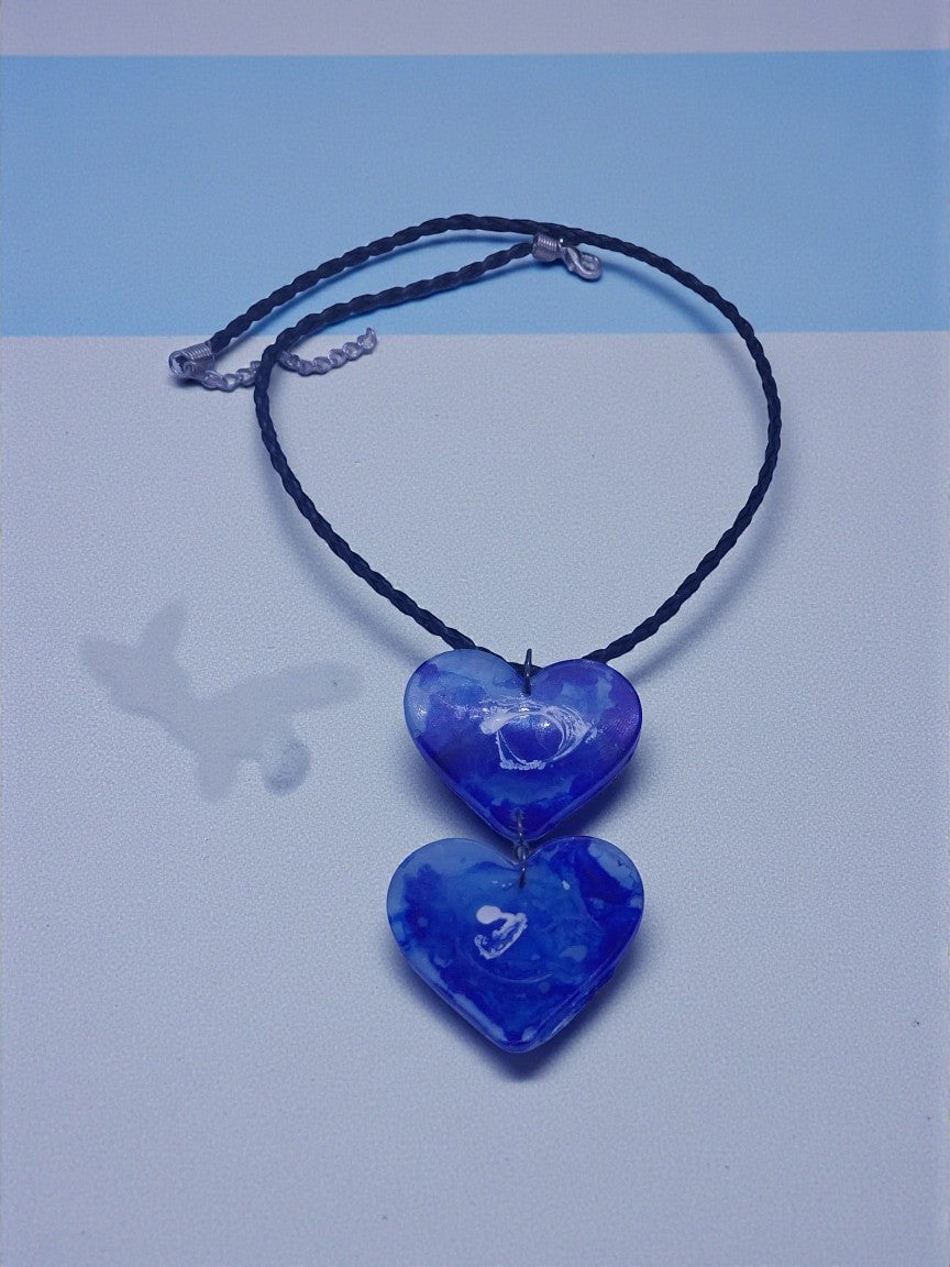 Artymunk3y blue marbled double heart pendant necklace on braided black cord. Adjustable.
