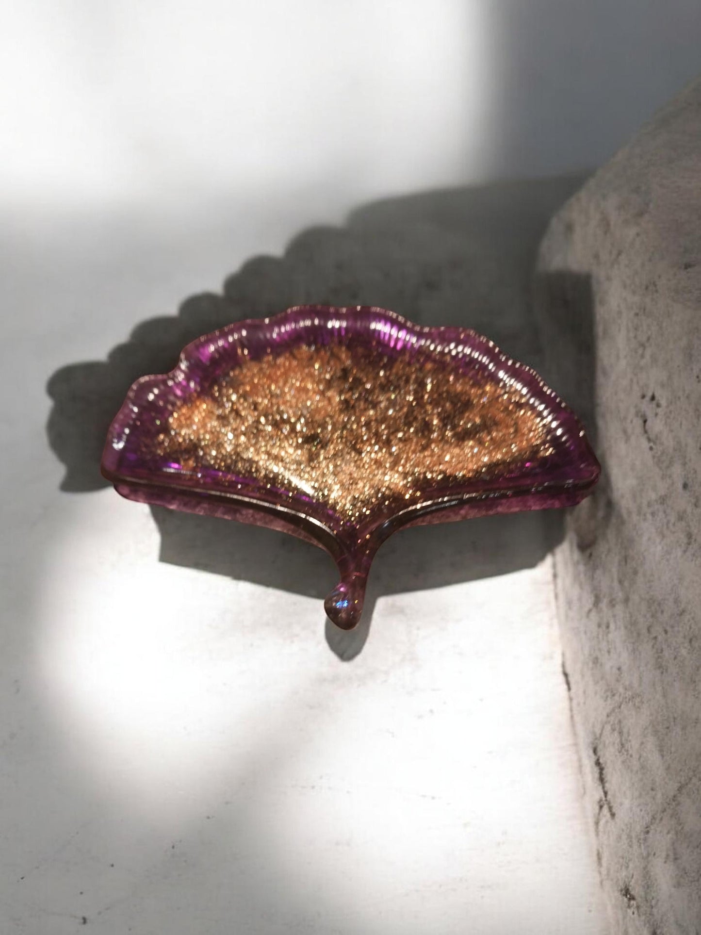 Artymunk3y Ginkgo leaf shaped resin trinket dish with gold glitter interior and translucent purple rim.