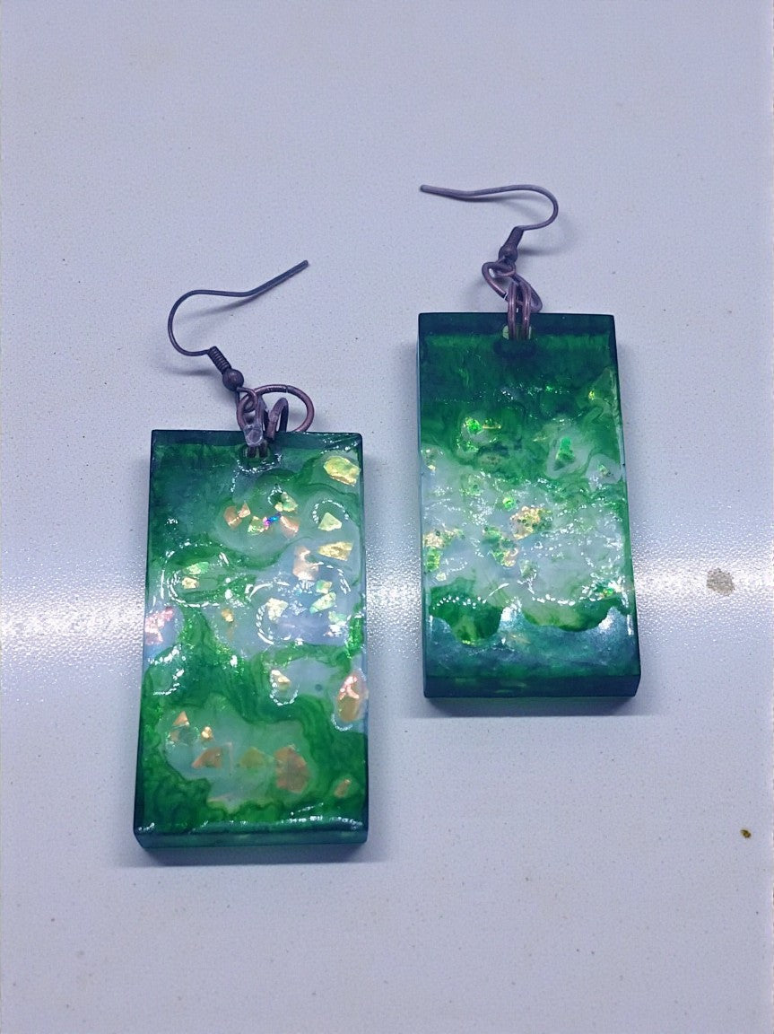 Artymunk3y green and white swirl resin dangle earrings with gold flecks and copper ear wires.