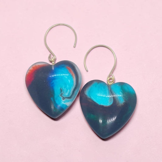 Artymunk3y handcrafted heart-shaped resin drop earrings in marbled midnight blue, turquoise, and crimson with gold hooks