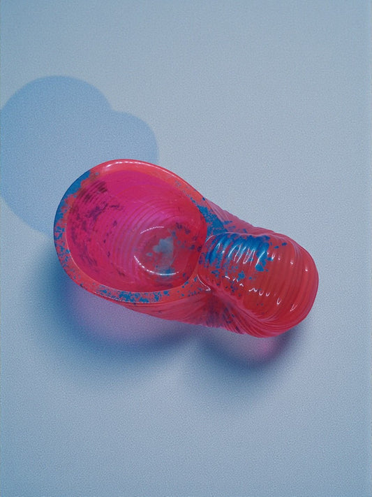 Artymunk3y neon pink nautilus shell decorative bowl with electric blue accents and ribbed texture.