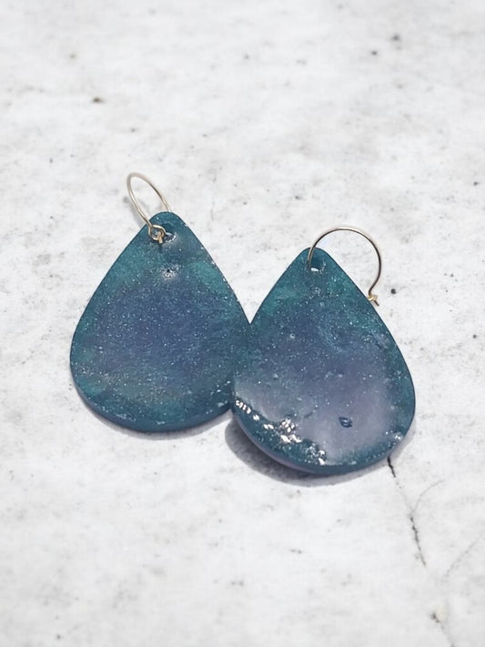 Artymunk3y teardrop dangle earrings in deep blue and emerald green with gold hooks. Shimmering marbled effect.