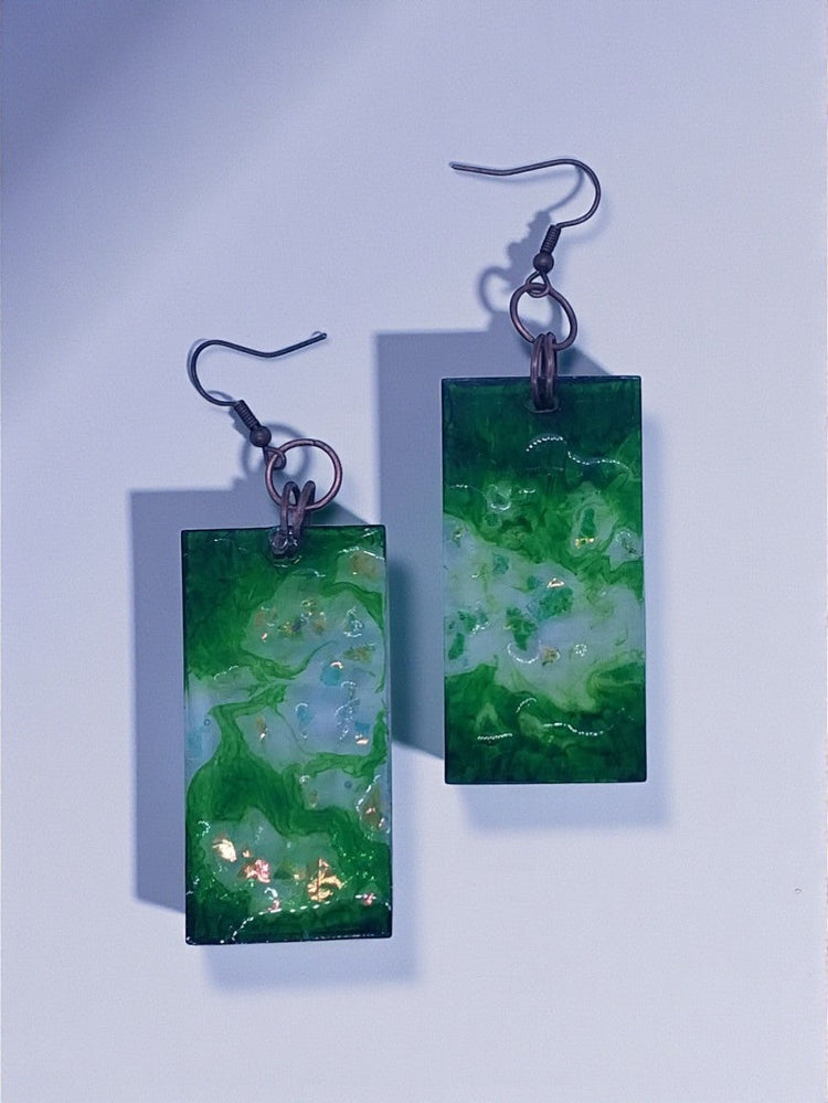 Artymunk3y green and white swirl resin dangle earrings with gold flecks and copper ear wires.