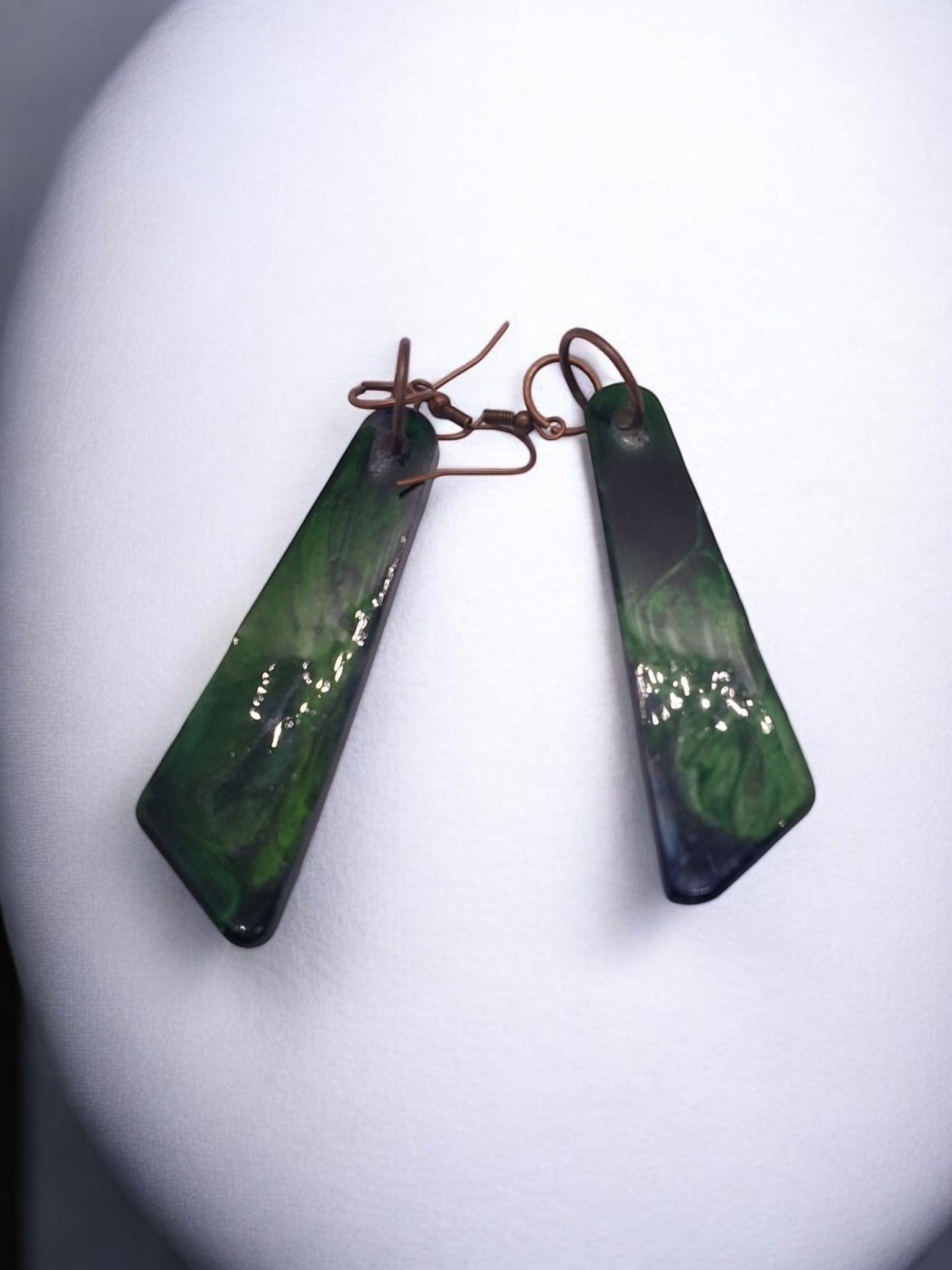 Artymunk3y abstract swirl dangle earrings in deep green with copper ear wires. Rectangular shape with glossy finish.