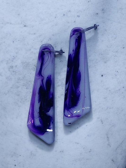 Artymunk3y abstract swirl dangle earrings in purple and indigo resin with a glossy finish.