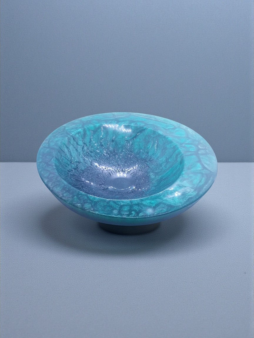 Artymunk3y blue and teal resin decorative bowl with textured exterior and glossy interior.