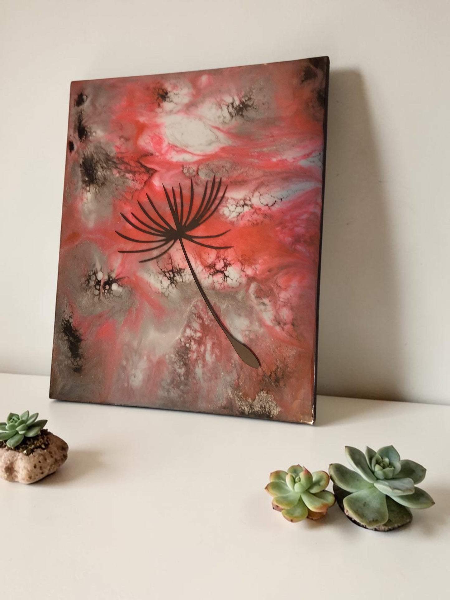 Artymunk3y dandelion seed resin wall art with abstract pink and earthy tones and a high-gloss finish.