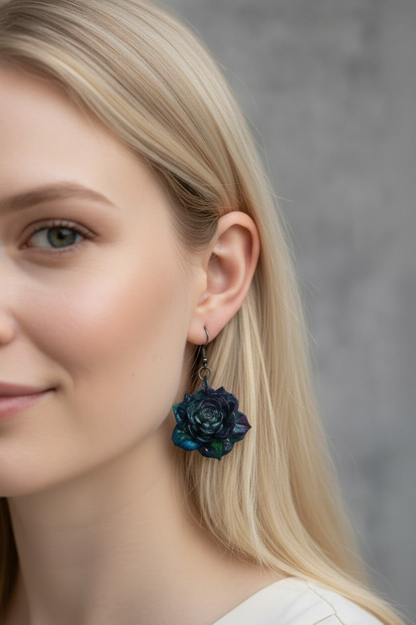 Artymunk3y handcrafted dark floral rose drop earrings in midnight blue and forest green worn by a blonde model