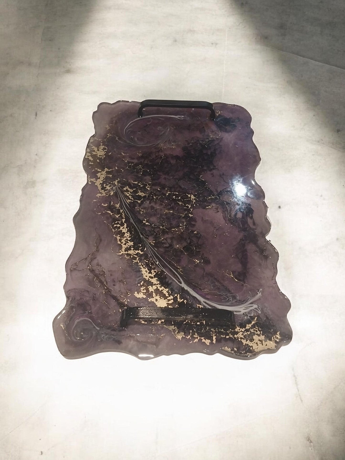 Artymunk3y decorative resin serving tray with handles, featuring a marbled purple and black pattern with gold flakes and black metal handles.
