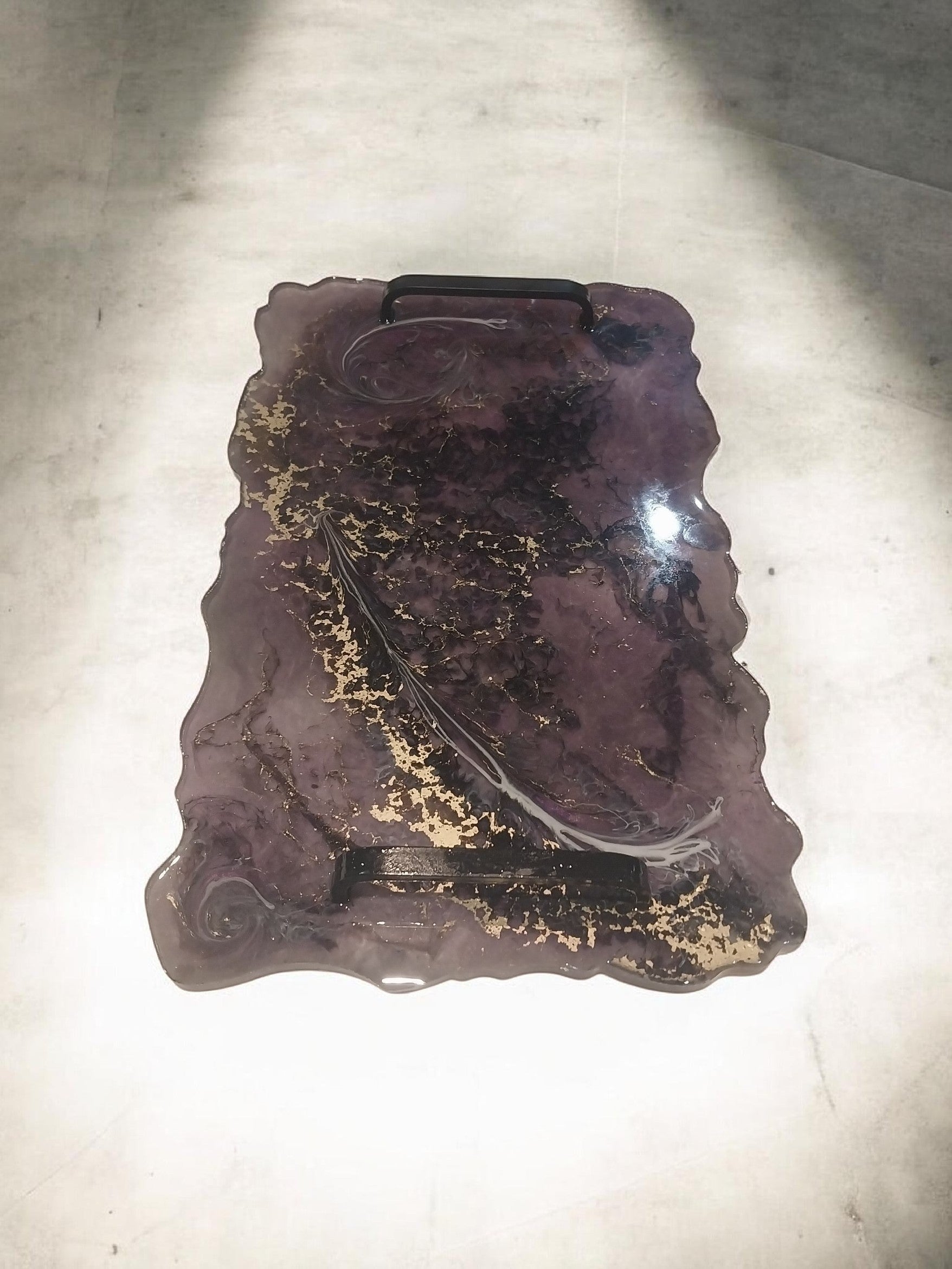 Artymunk3y decorative resin serving tray with handles, featuring a marbled purple and black pattern with gold flakes and black metal handles.