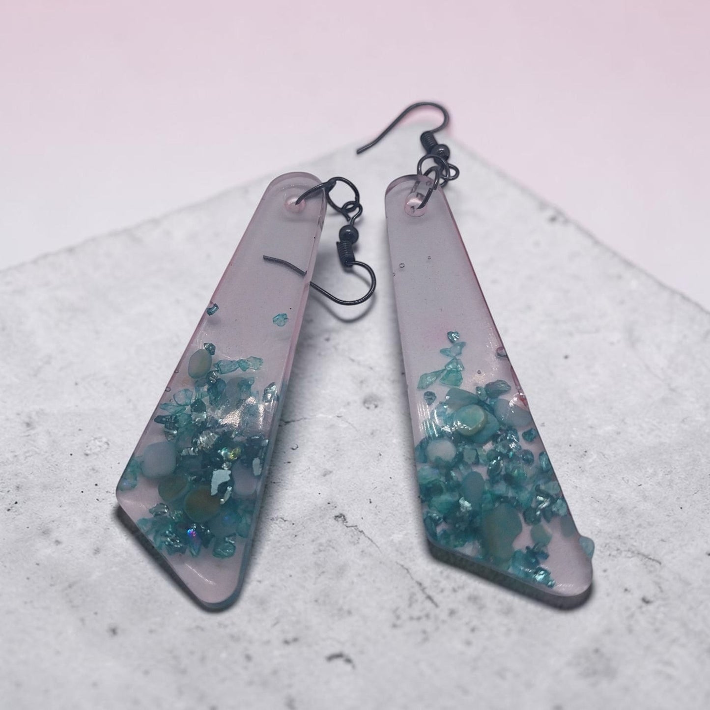 Artymunk3y geometric dangle earrings featuring translucent frosted resin with embedded teal and turquoise stone chips.
