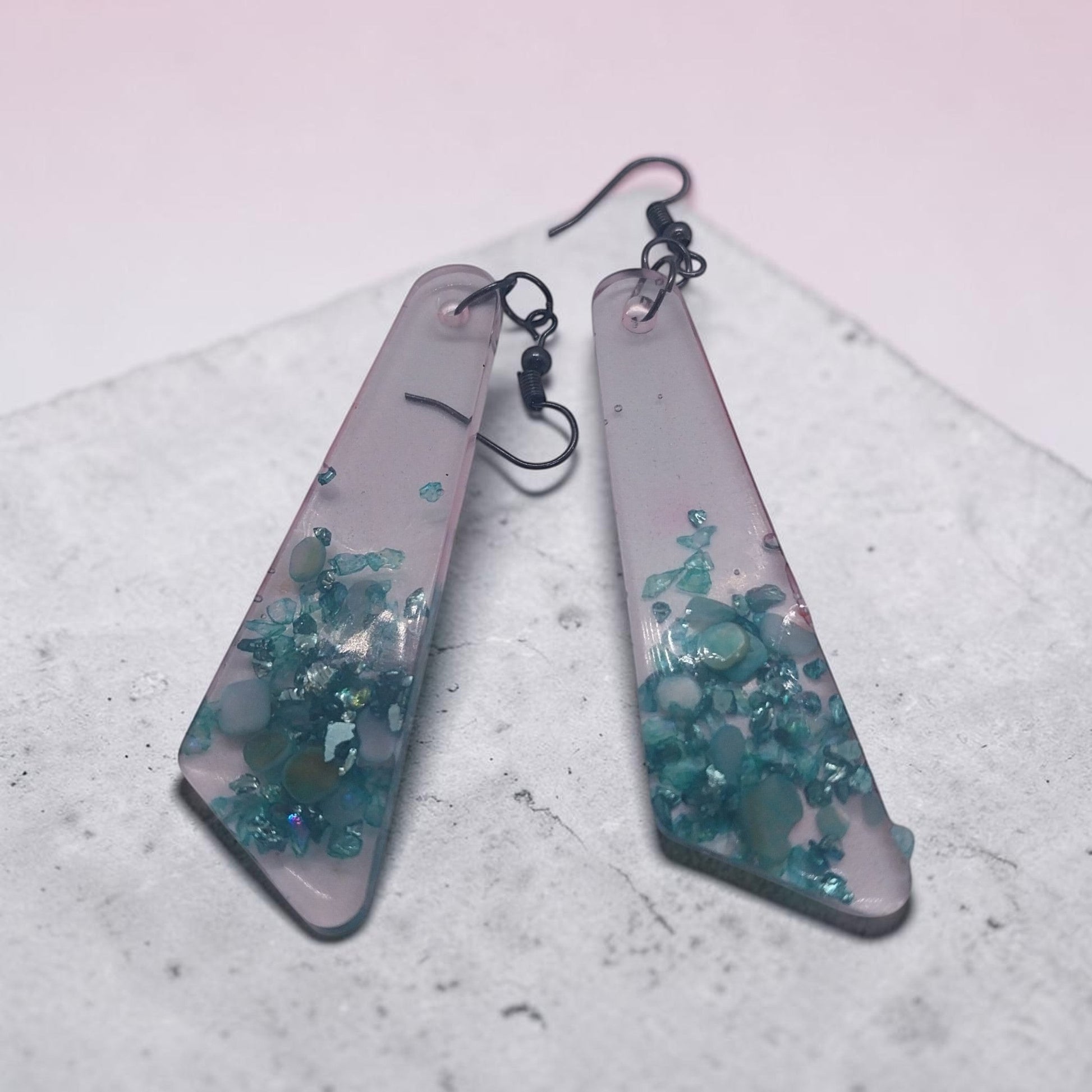 Artymunk3y geometric dangle earrings featuring translucent frosted resin with embedded teal and turquoise stone chips.