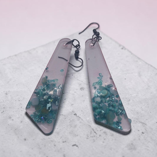 Artymunk3y geometric dangle earrings featuring translucent frosted resin with embedded teal and turquoise stone chips.