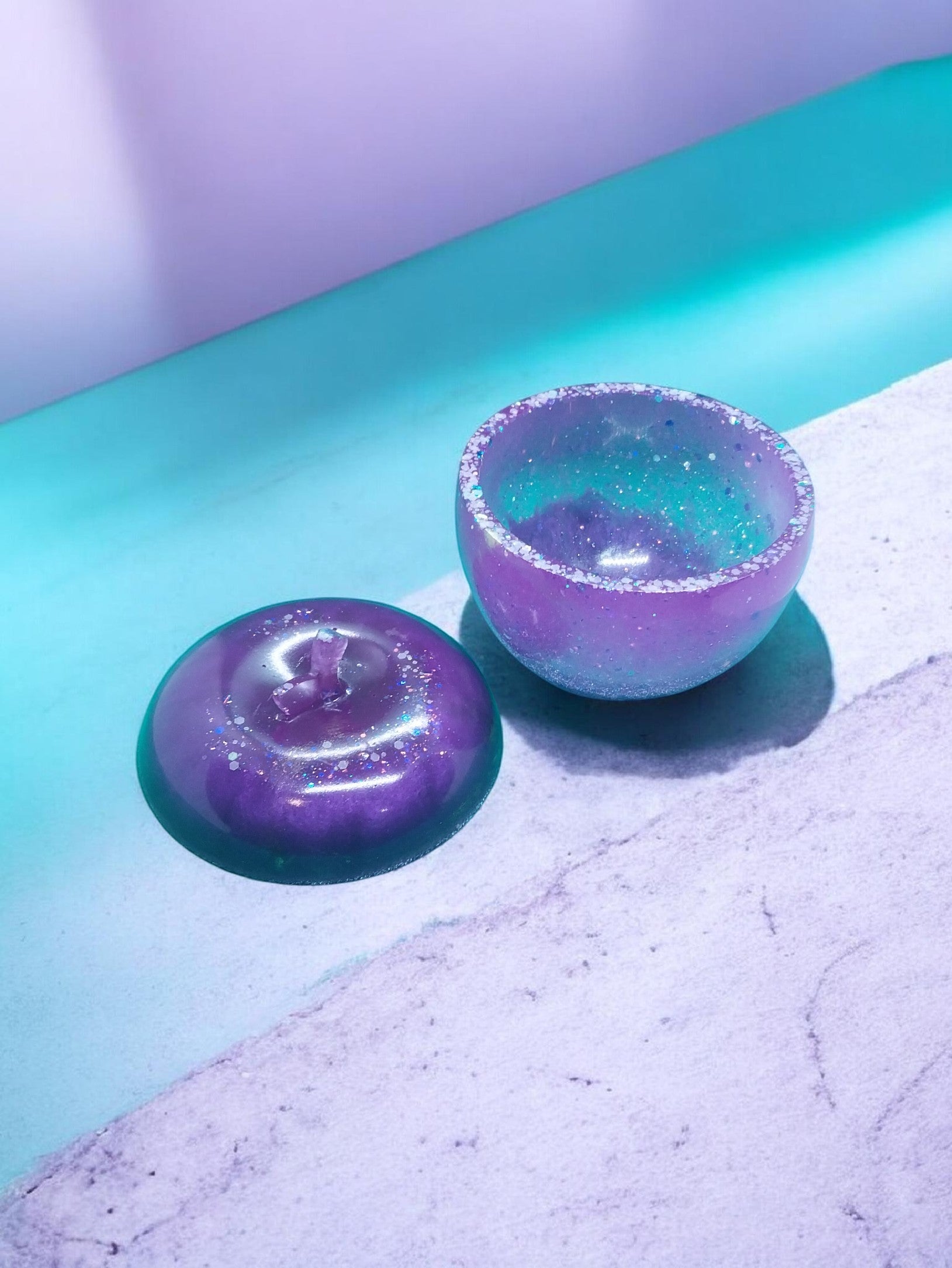 Artymunk3y purple and teal glitter apple trinket dish with lid off, resin storage for jewelry or desk items.