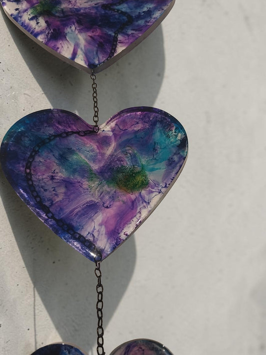 Artymunk3y hanging heart resin wall art with purple, blue, and green galaxy design. Unique abstract patterns.