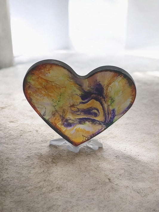 Artymunk3y heart shaped resin display with abstract yellow, orange, purple, and green swirls. Glossy finish.