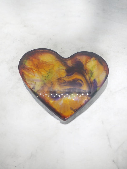 Artymunk3y heart-shaped resin display with abstract swirls of yellow, orange, purple, and green. Glossy finish.