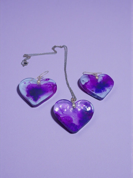 Artymunk3y Heart Shaped Resin Pendant Necklace and Earring Set with purple and white marbled design.