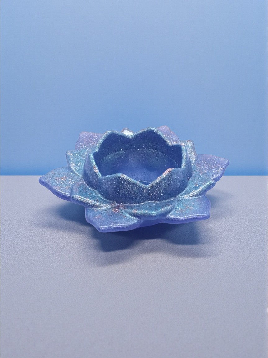 Artymunk3y iridescent lotus flower tealight candle holder with lavender, blue, and teal hues and subtle sparkle.