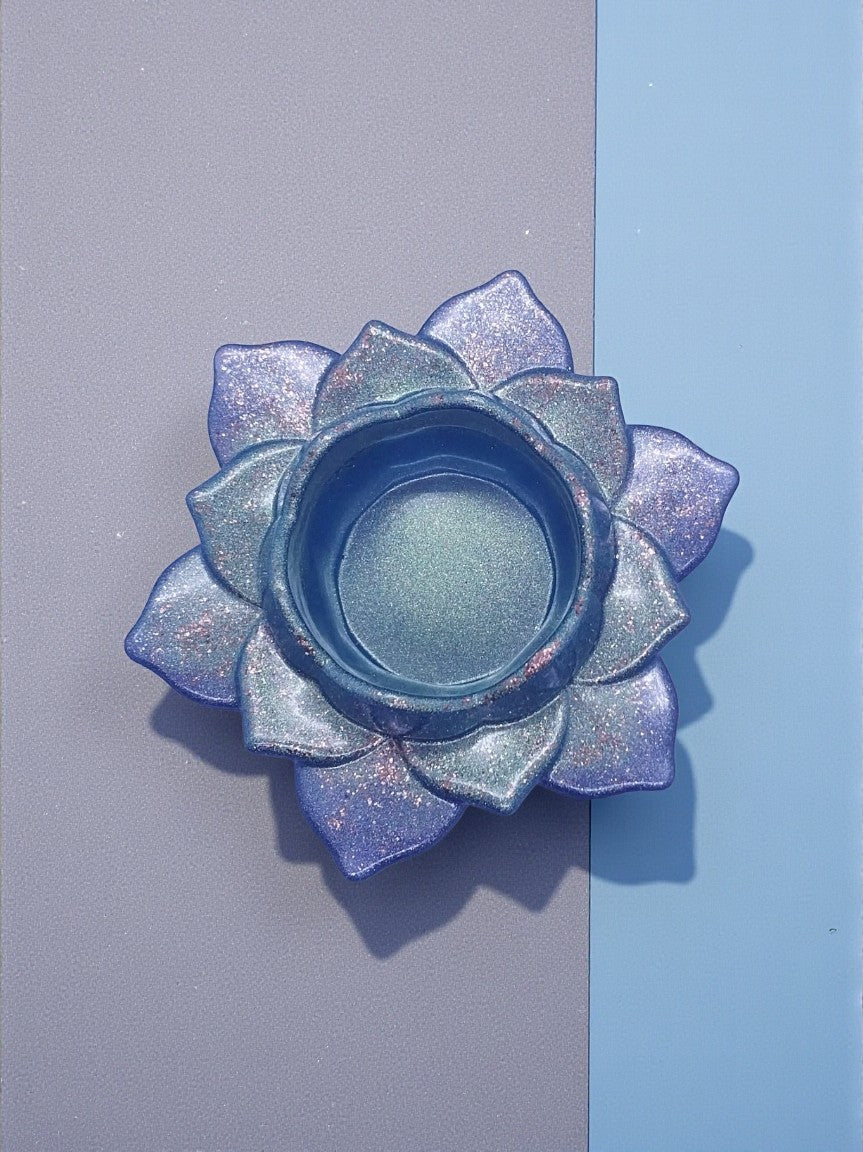 Artymunk3y iridescent lotus flower tealight candle holder with lavender, blue, and teal hues and subtle sparkle.