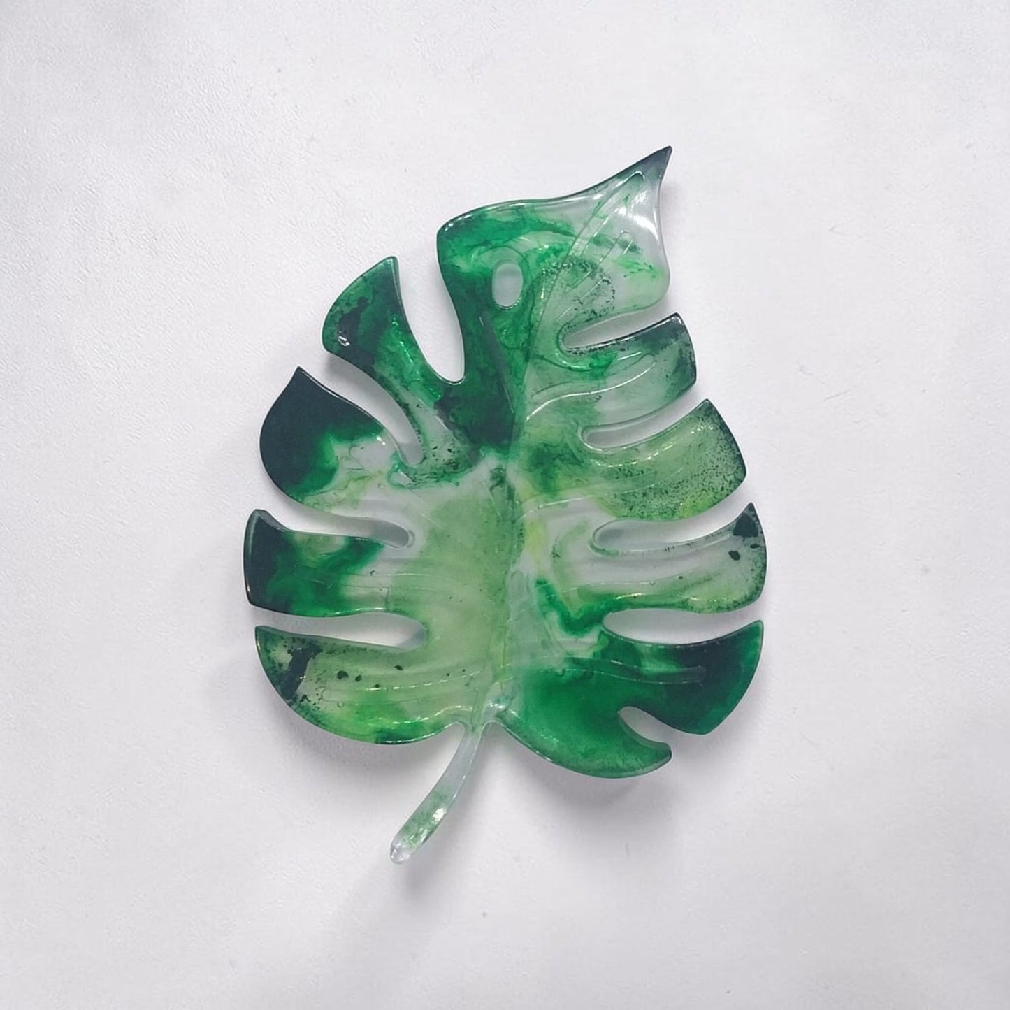 Artymunk3y monstera leaf shaped decorative resin tray in marbled forest green and translucent white