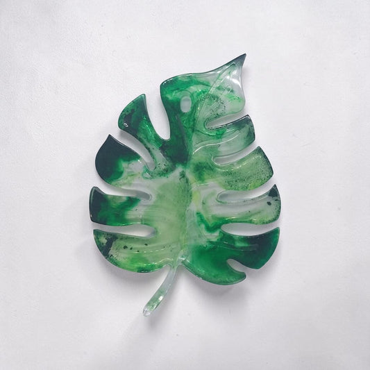 Artymunk3y monstera leaf shaped decorative resin tray in marbled forest green and translucent white