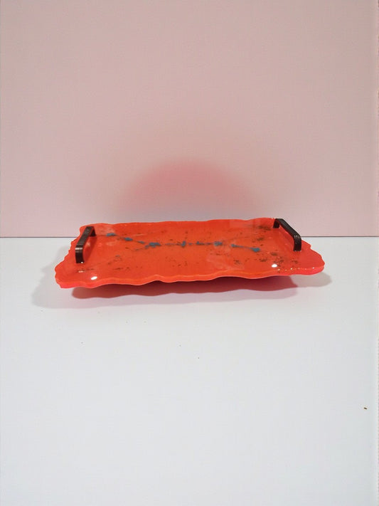Artymunk3y orange resin serving tray with black handles and turquoise flecks. Irregular edge design.