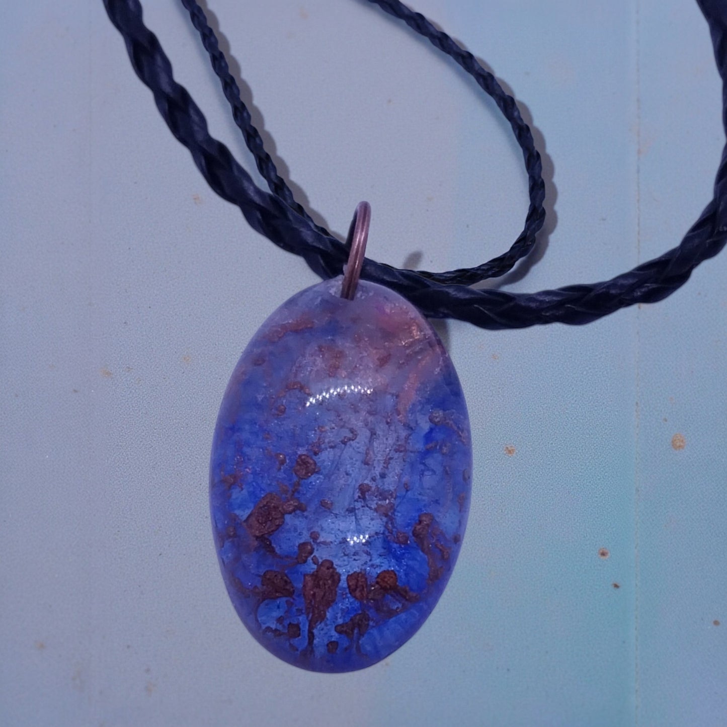 Artymunk3y blue and purple marbled oval pendant necklace with braided black cord. Unique, organic pattern.