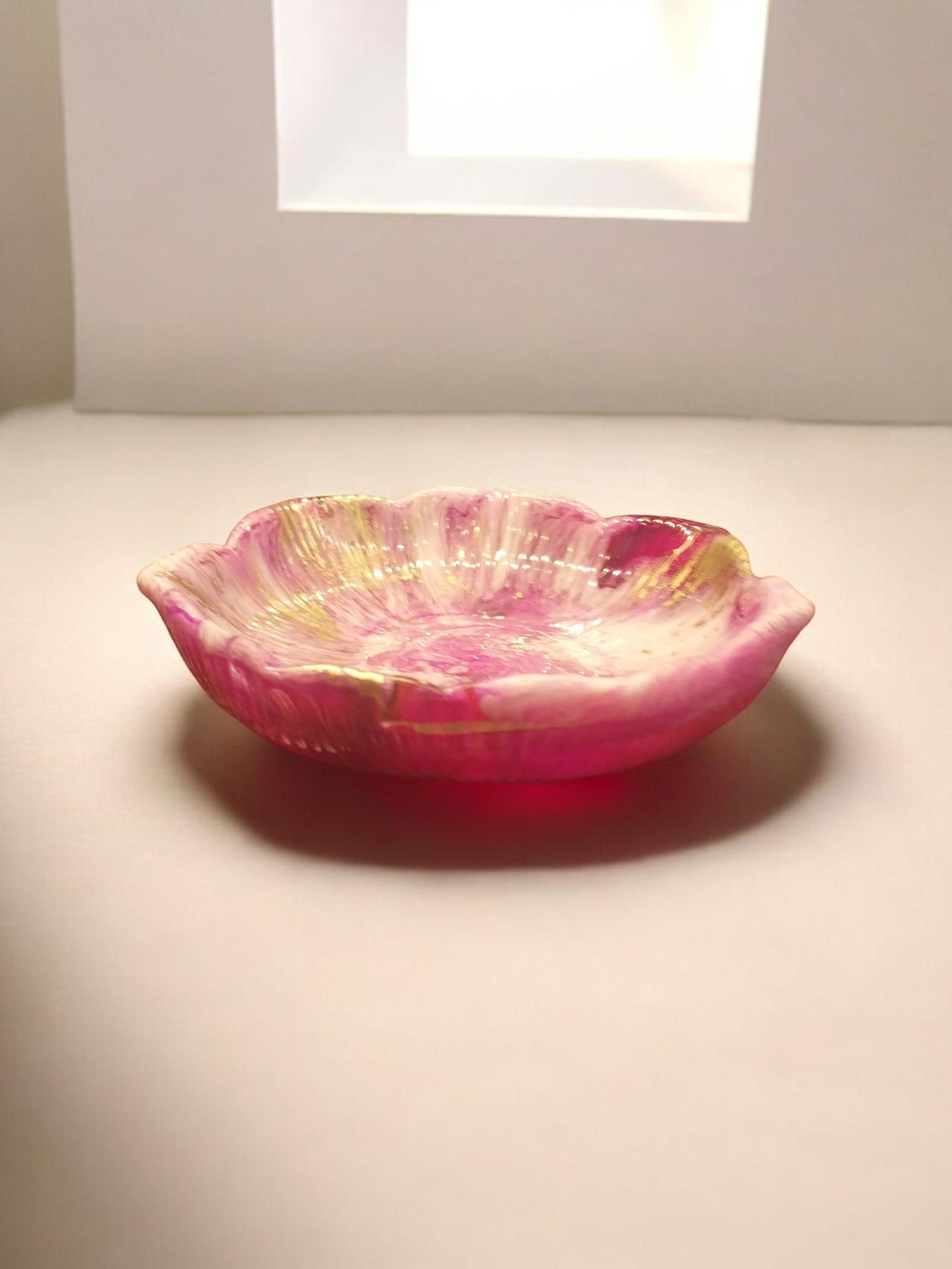 Artymunk3y pink, white, and gold swirled petal-shaped trinket dish with scalloped edges.
