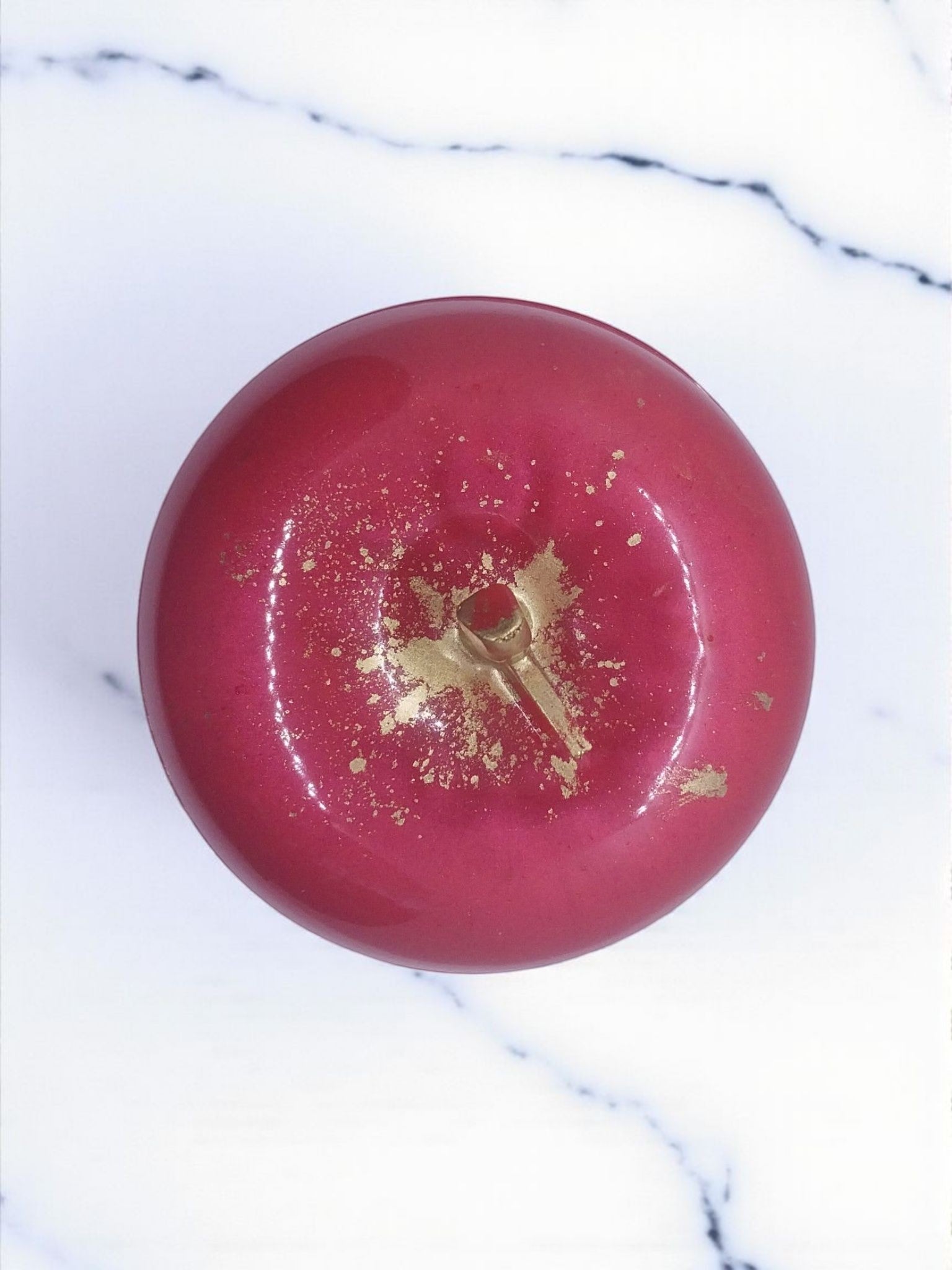 Artymunk3y decorative apple shaped trinket box in glossy pink with gold flecks and a stem detail.