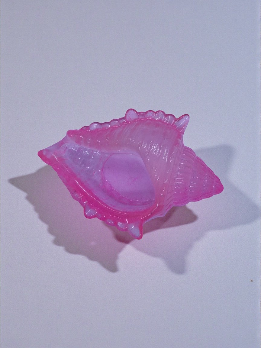 Artymunk3y pink translucent resin seashell trinket dish with swirling colors and organic shape.