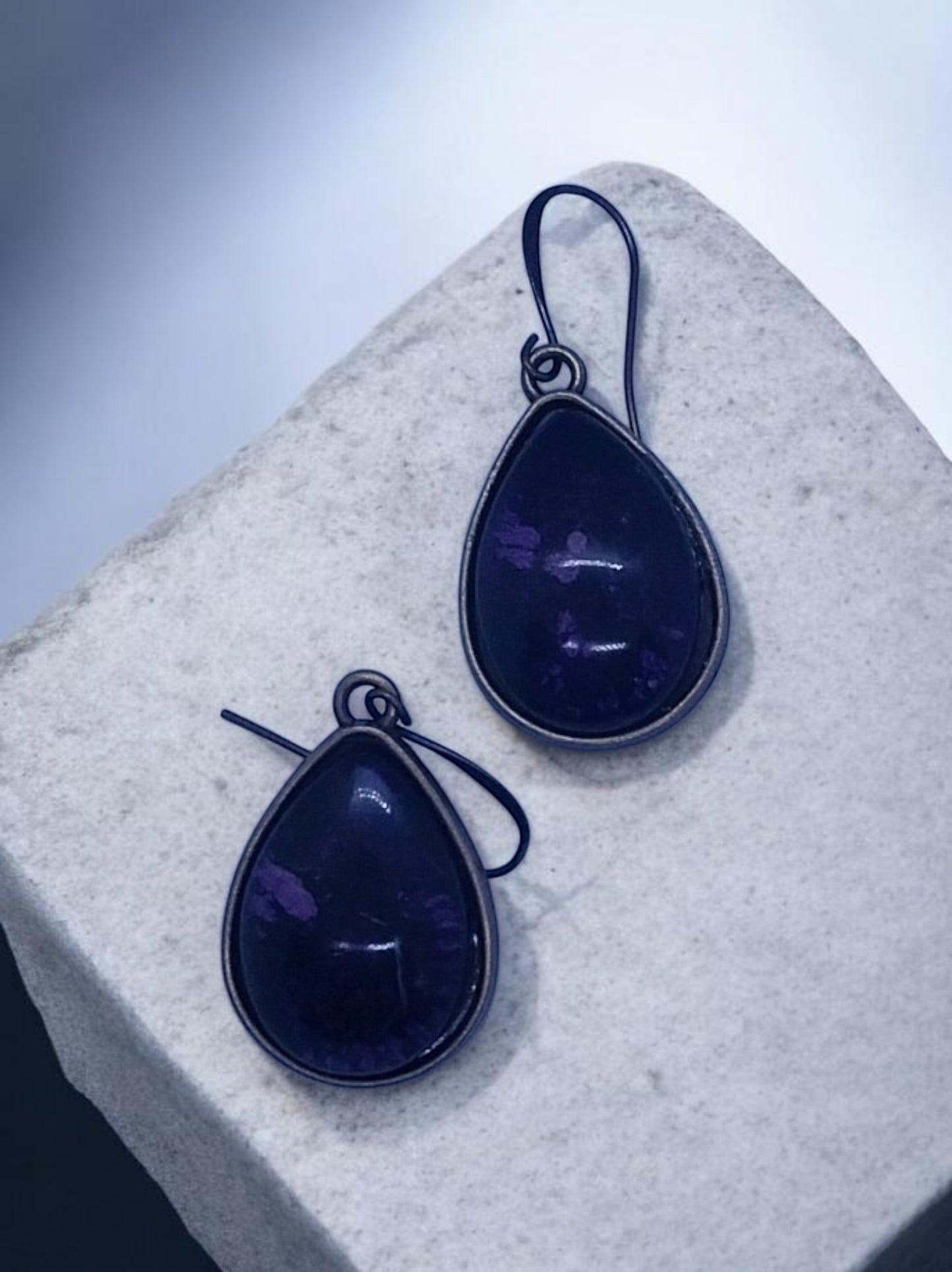 Artymunk3y teardrop gemstone dangle earrings in deep purple with antiqued metal bezel and ear wires.