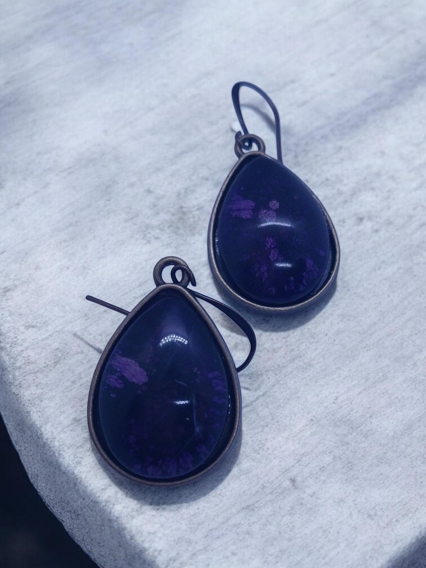 Artymunk3y teardrop gemstone dangle earrings in deep purple with unique inclusions and antiqued metal bezel.