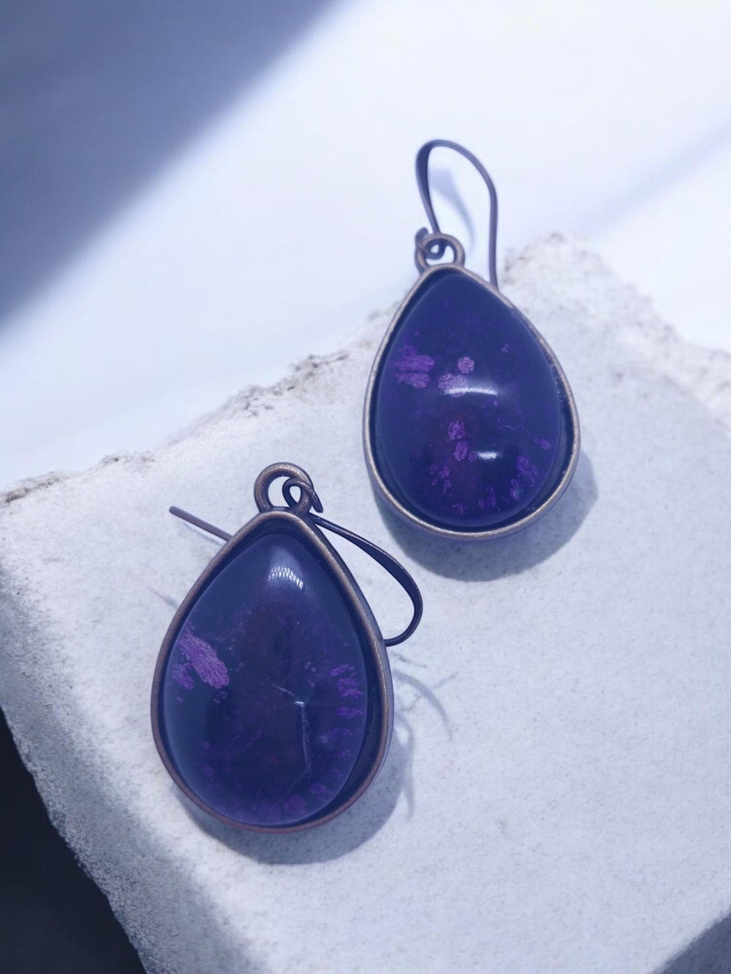 Artymunk3y teardrop purple gemstone dangle earrings with antiqued metal bezel and ear wires.