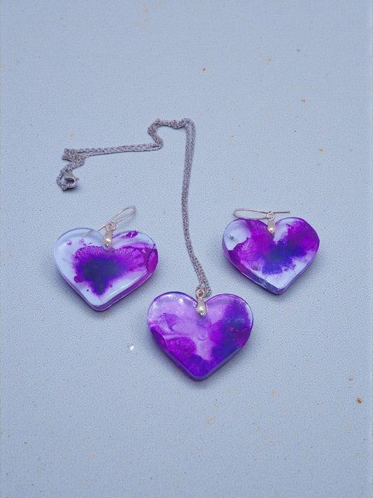 Artymunk3y purple and white marbled resin heart pendant necklace and earring set with silver-tone chain.