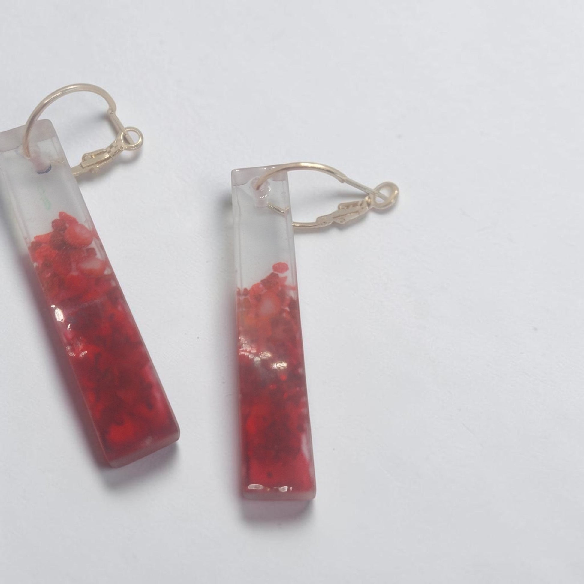 Artymunk3y rectangular resin drop earrings featuring a red gradient effect and gold-tone hoop findings.