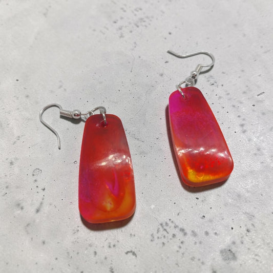 Artymunk3y rectangular resin drop earrings featuring a marbled sunset palette of red, orange, and pink with silver hooks