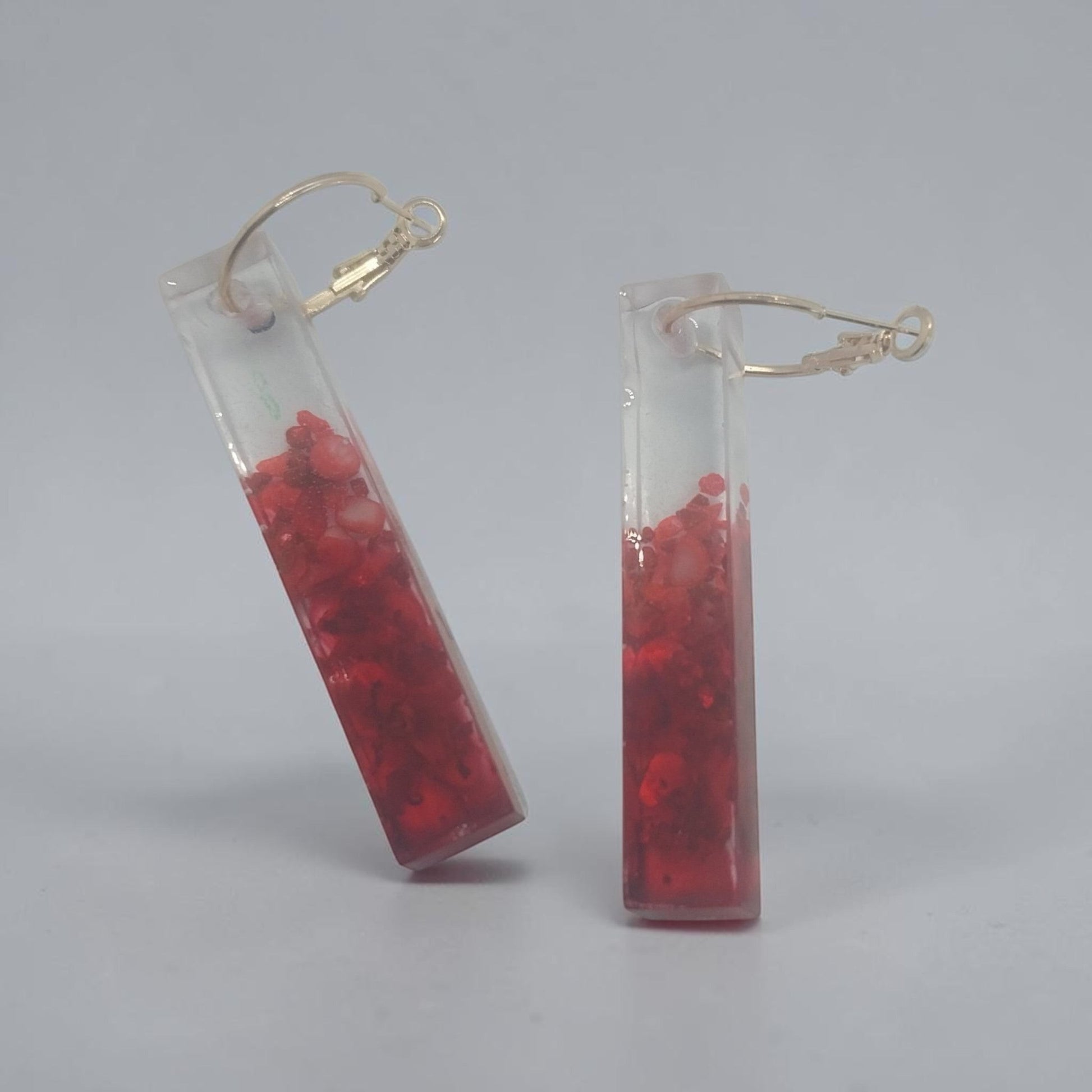 Artymunk3y rectangular resin drop earrings with clear and red gradient accents on gold-tone hoop findings.
