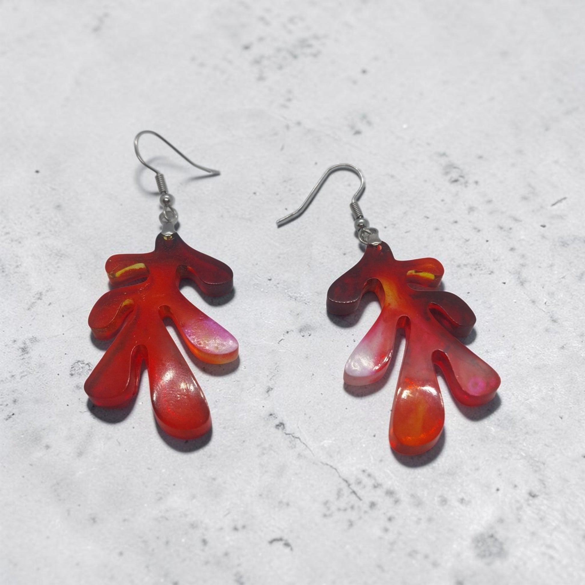 Artymunk3y organic shape drop earrings in translucent fiery red and orange resin with silver-toned hooks