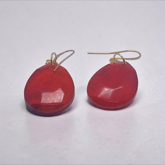 Artymunk3y faceted red teardrop dangle earrings with gold-tone hooks on a white background