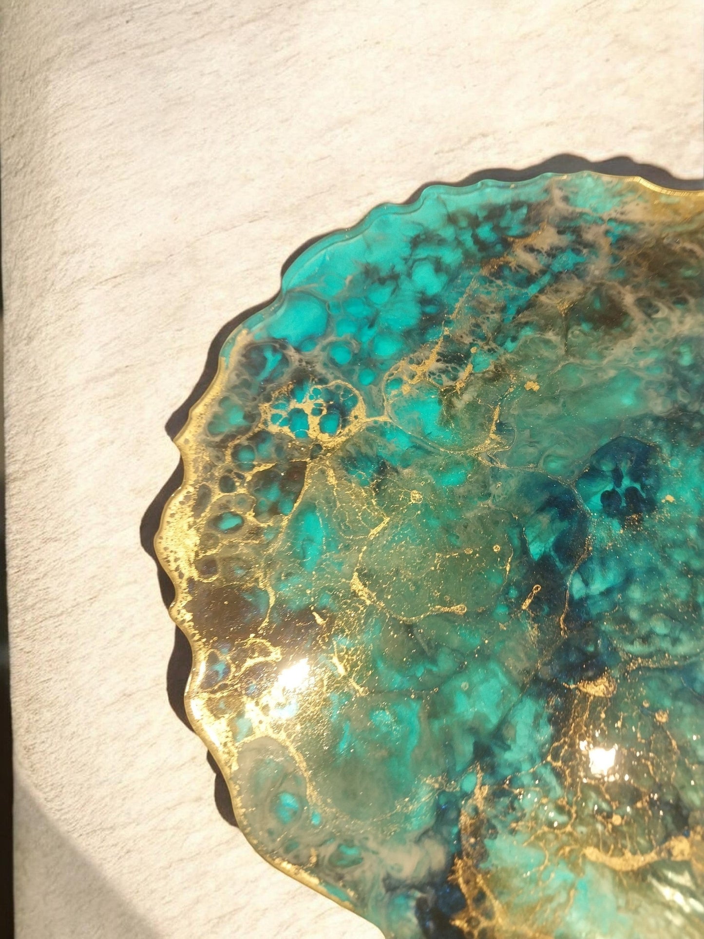 Artymunk3y round resin tray with swirling turquoise, blue, and gold agate-like patterns. Glossy finish.