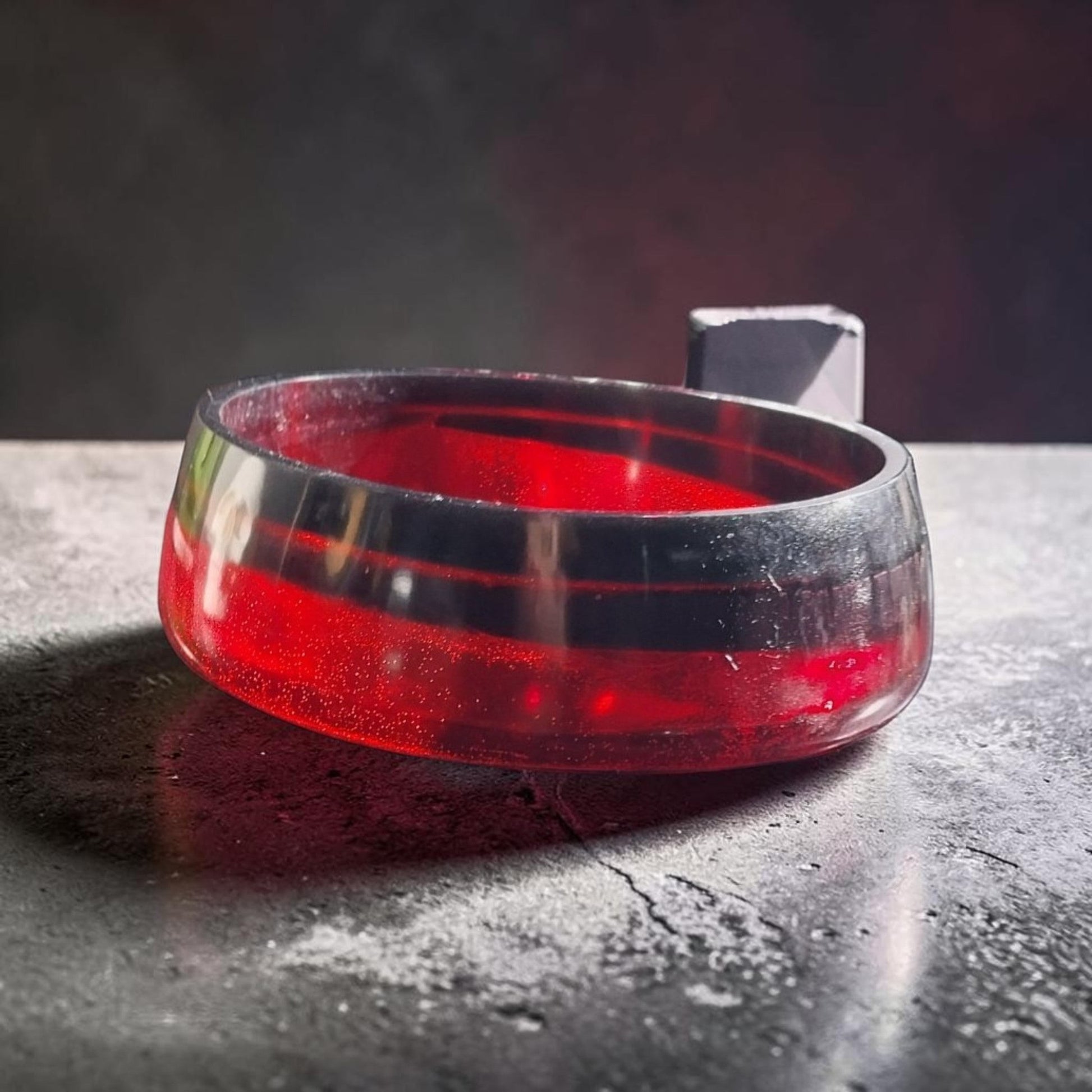 Artymunk3y handcrafted resin bowl in translucent ruby red and opaque black, featuring a polished, modern layered design.