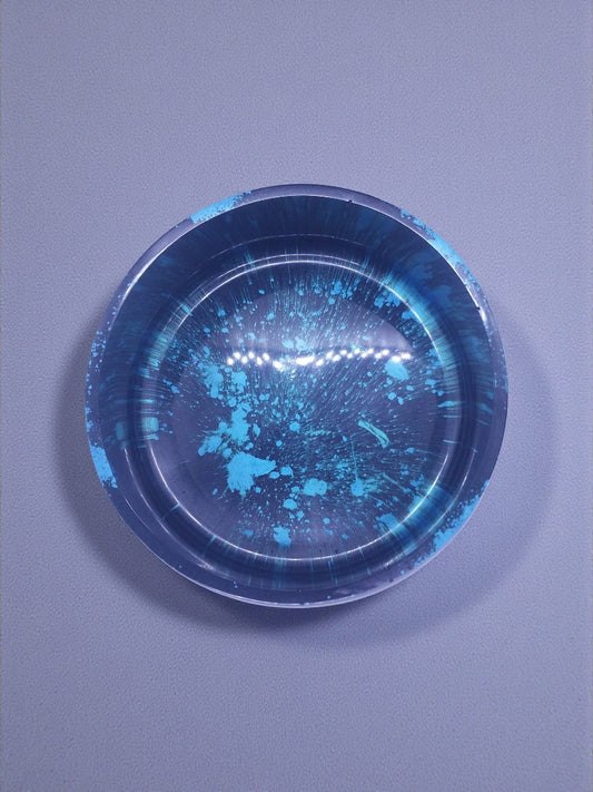 Artymunk3y decorative bowl with blue splatter pattern on dark base, made of resin.