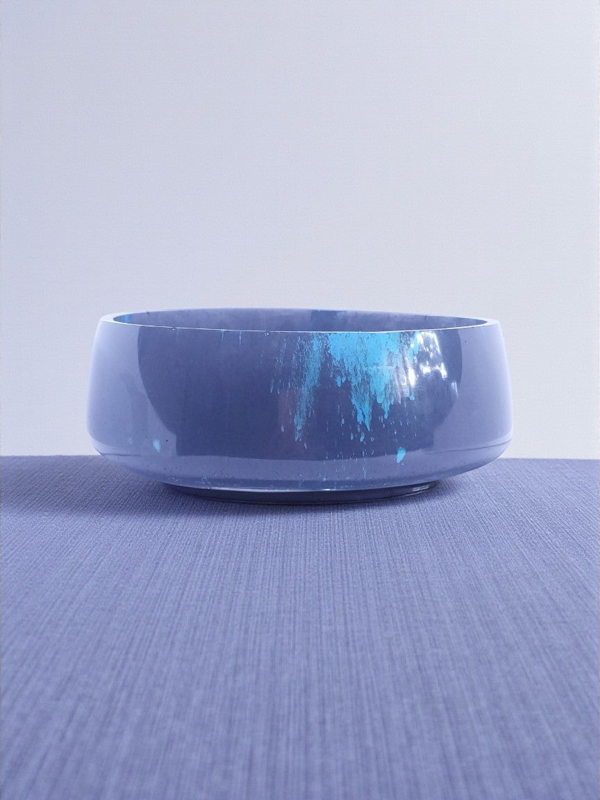 Artymunk3y decorative bowl with blue splatter pattern on dark base, made of resin.
