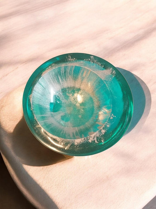 Artymunk3y decorative resin trinket dish in translucent teal with white and gold swirls. Perfect for jewelry or keys.
