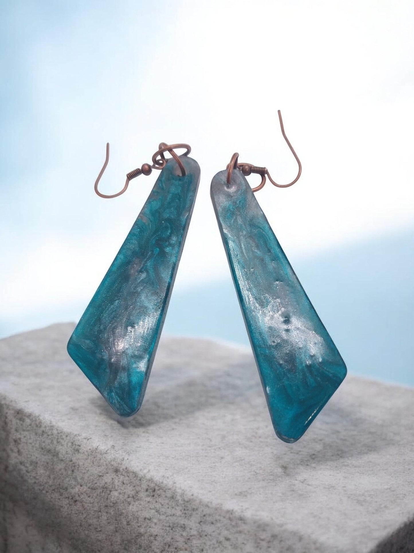 Artymunk3y Teal Swirl Resin Drop Earrings with geometric shape and copper-toned ear wires.