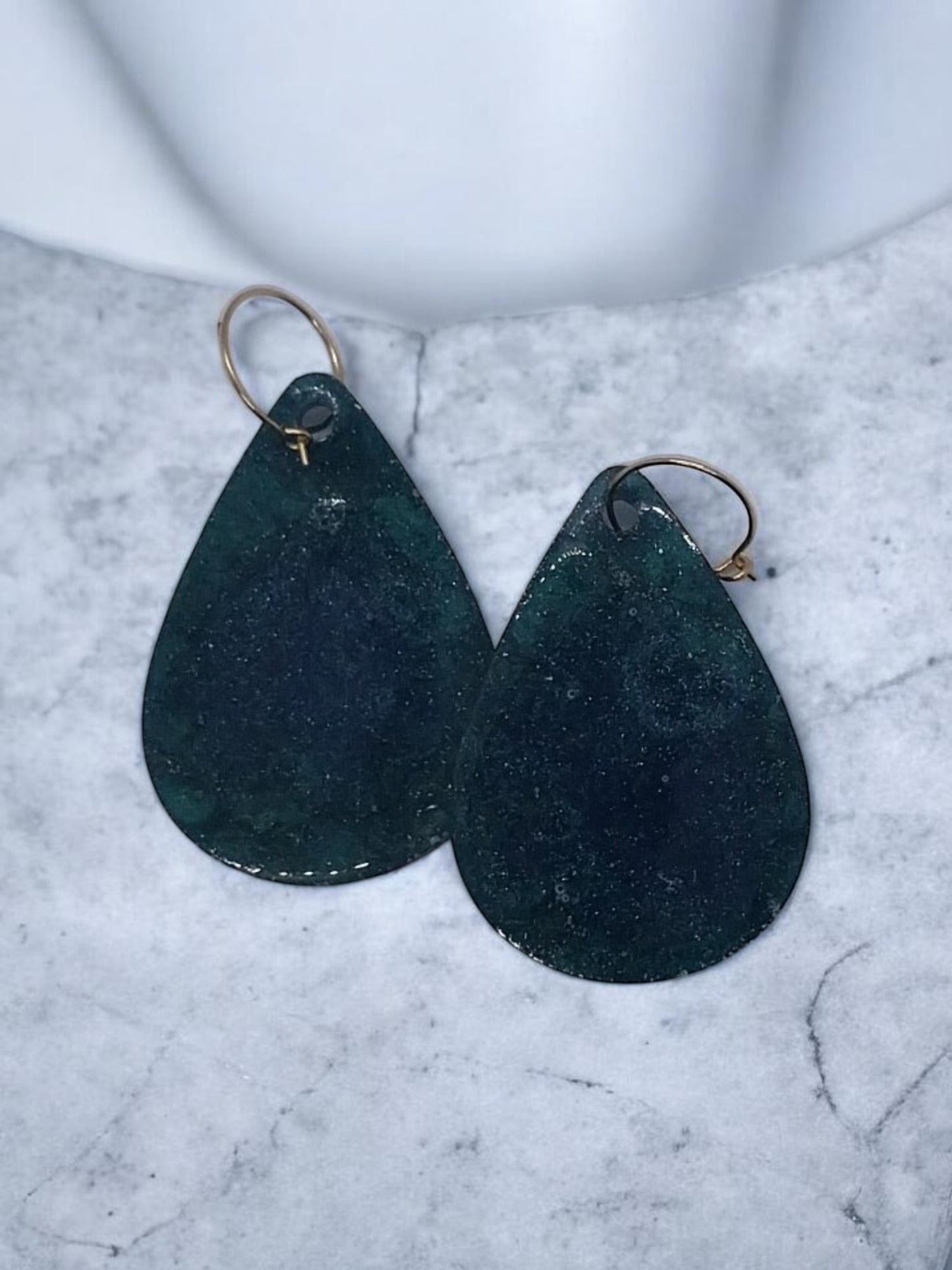Artymunk3y teardrop dangle earrings in deep blue and green with gold hooks. Shimmering marbled effect.