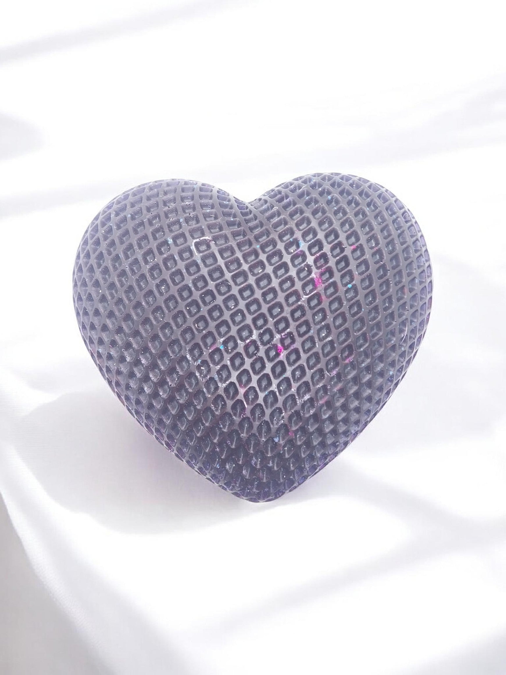 Artymunk3y dark purple textured heart-shaped decorative object with geometric pattern and subtle glitter accents.
