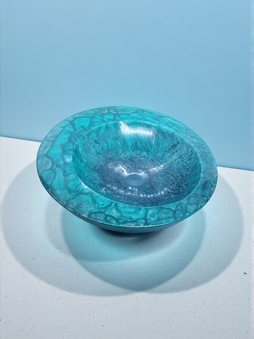 Artymunk3y decorative bowl in deep blue and teal resin with textured exterior and glossy interior.
